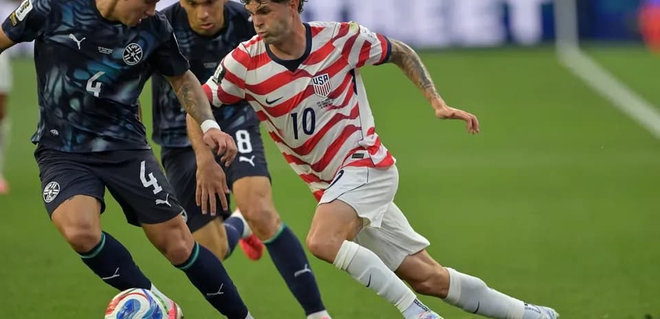 Two players contesting the ball during a match