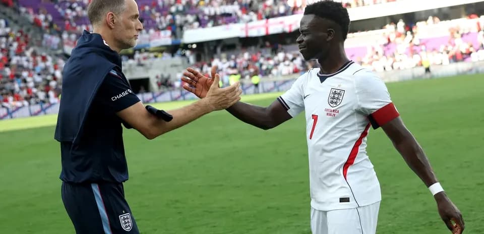 Coach and player shaking hands on field