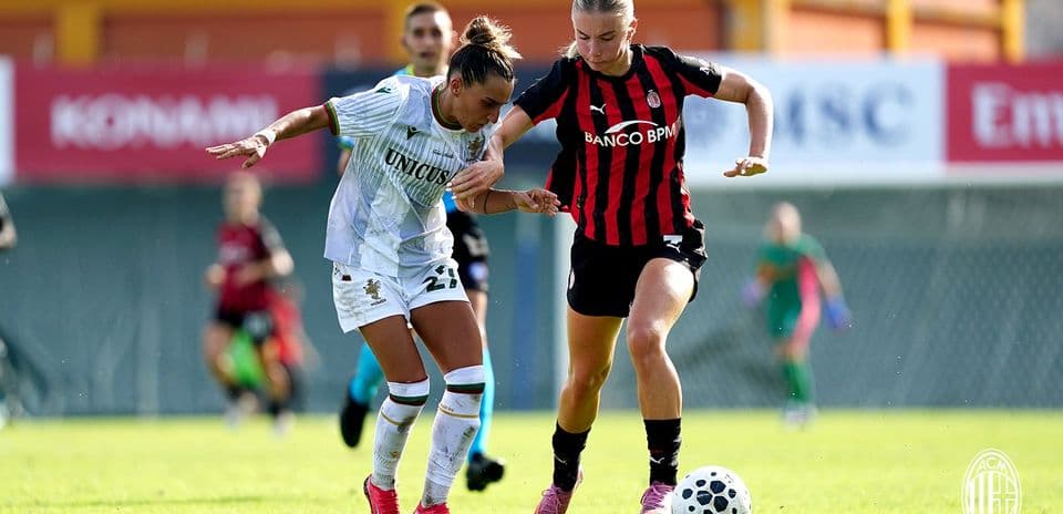 Two players contesting for the ball during match