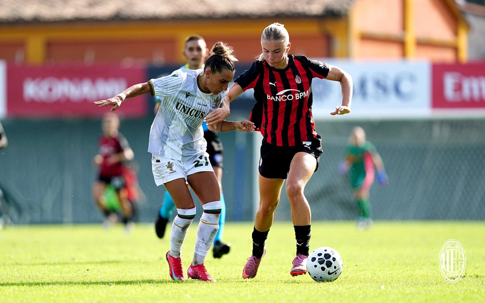 Two players contesting for the ball during match