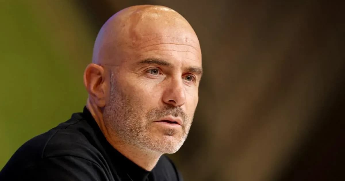Coach speaking at a press conference