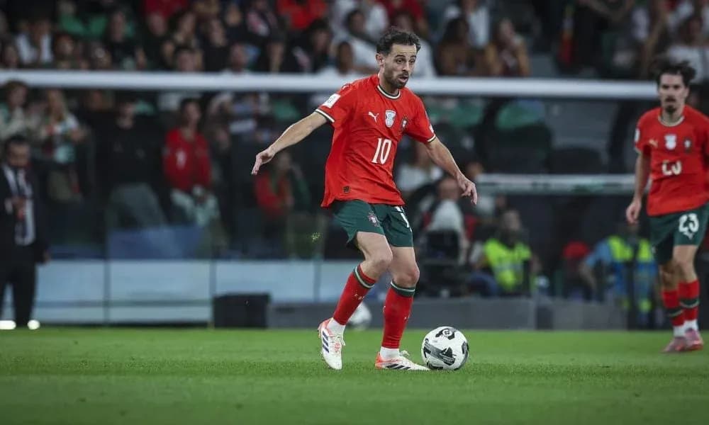 Player in red jersey controlling the ball on field