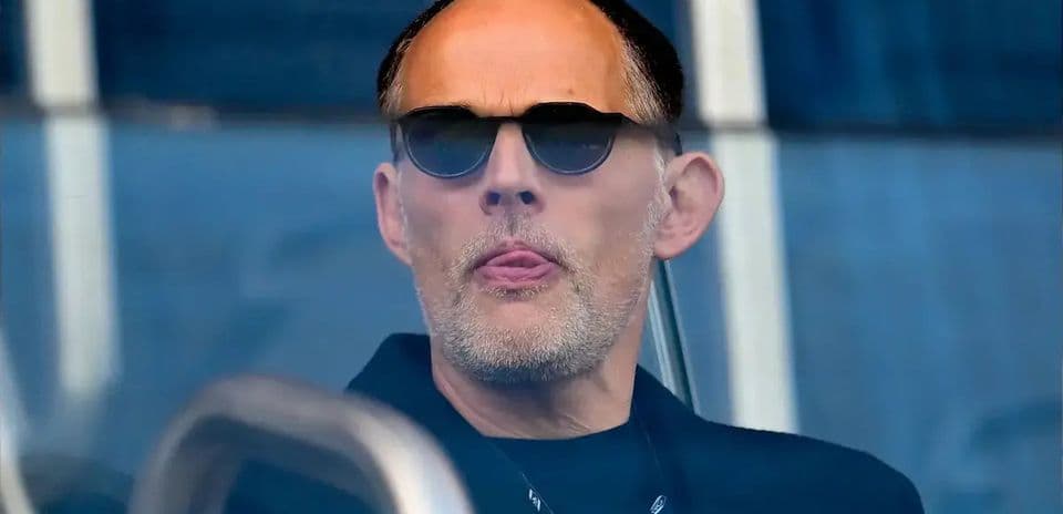 Man wearing sunglasses watching from a box