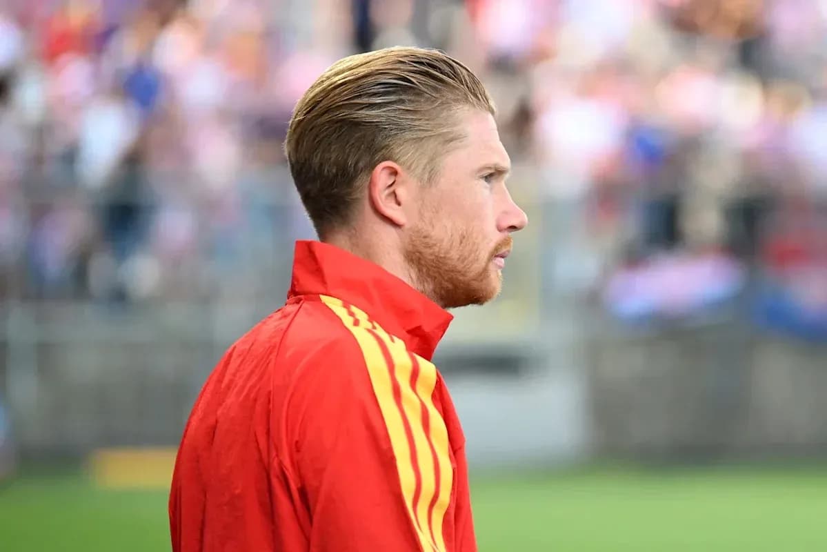 Player in red tracksuit during warm-up
