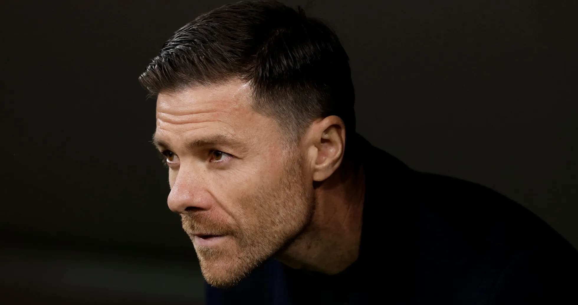Coach focused during match from the sidelines