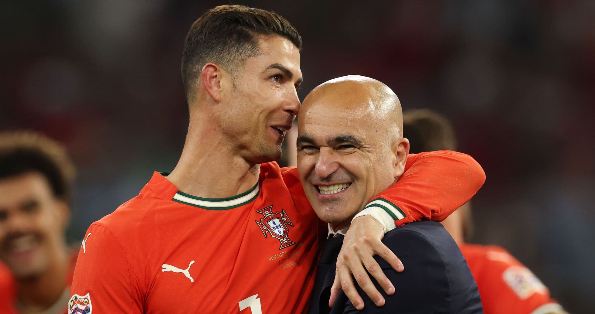 Cristiano Ronaldo and coach celebrating after match