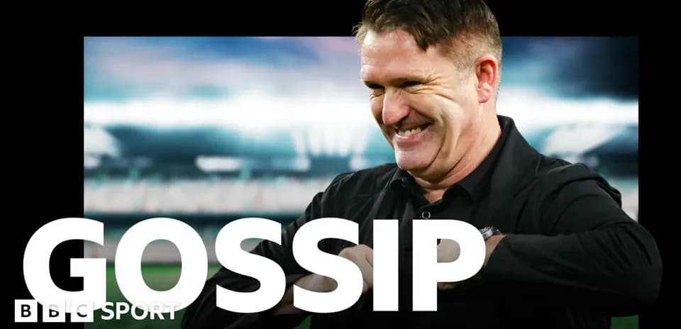 Man smiling in front of a stadium backdrop