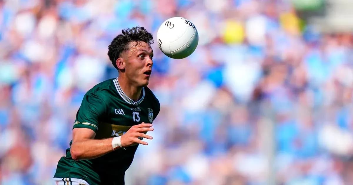 Player catching a Gaelic football during match