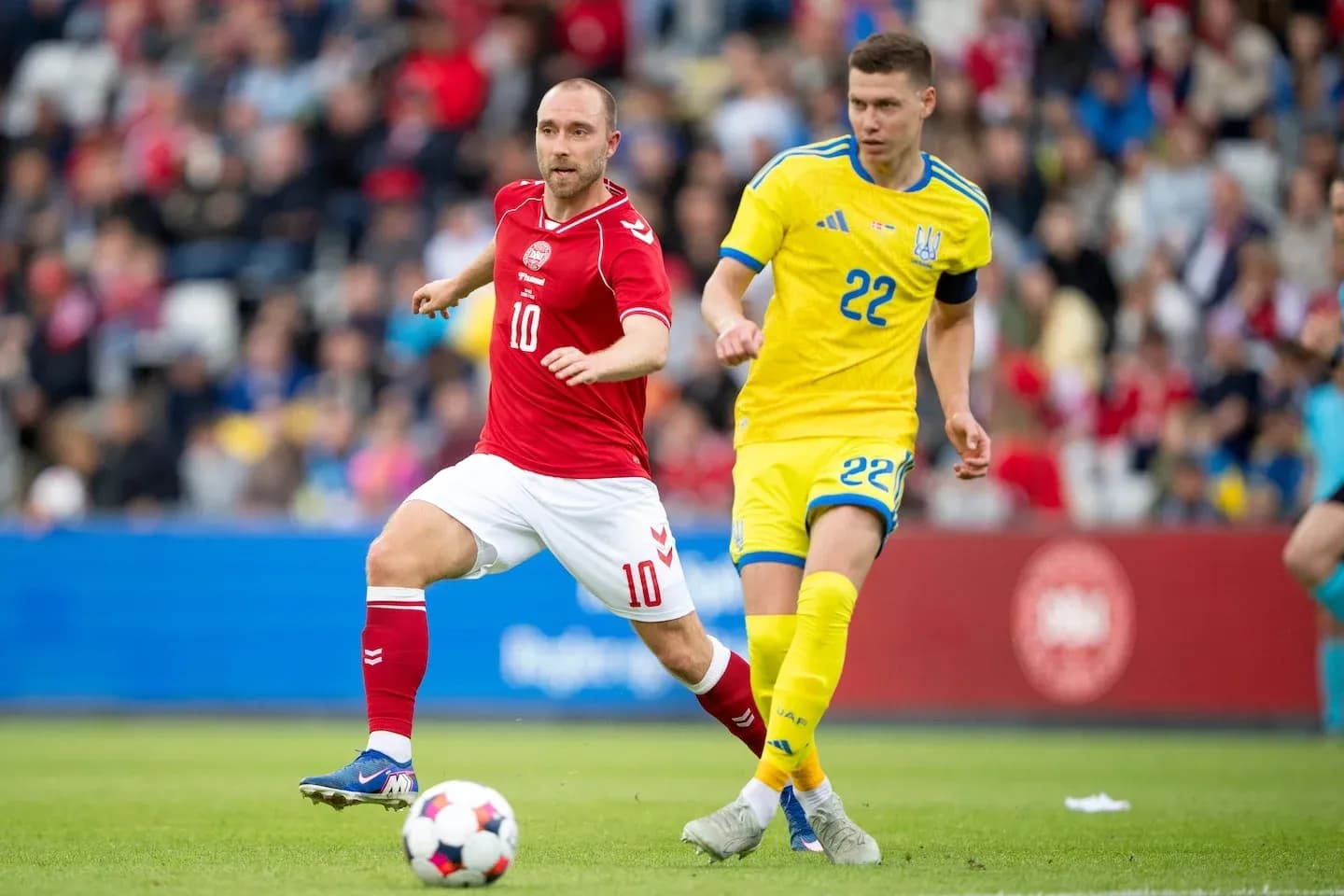 Two players competing for the ball during match