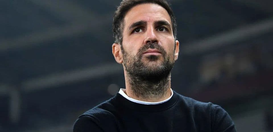 Man observing from sidelines during a match