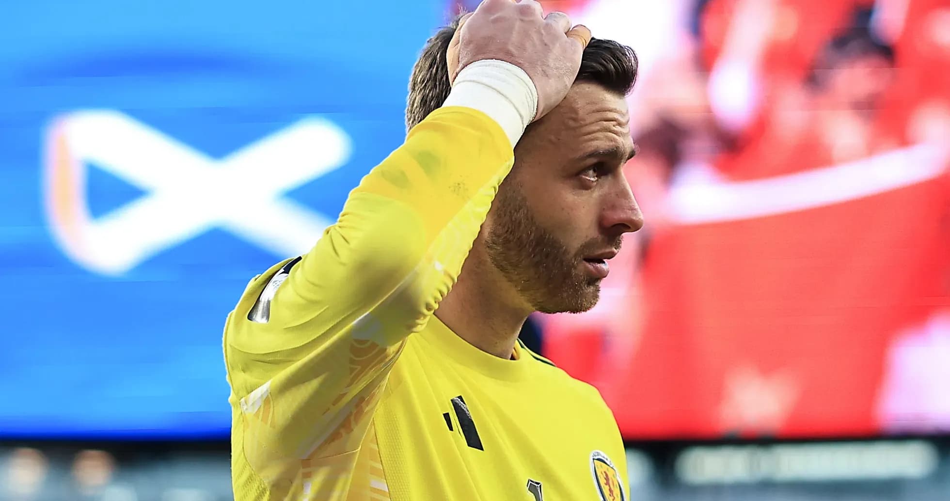 Goalkeeper in yellow jersey during match action