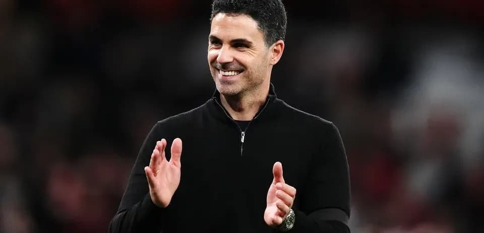 Manager applauding during a match at stadium