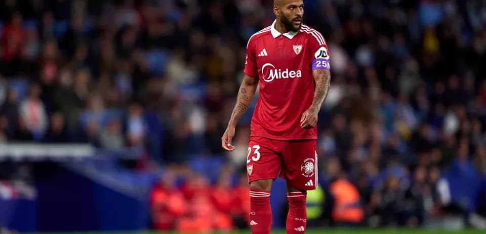 Sevilla player walking on the pitch during match