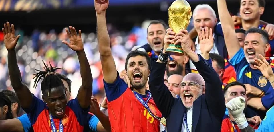 Team celebrating victory with FIFA World Cup trophy