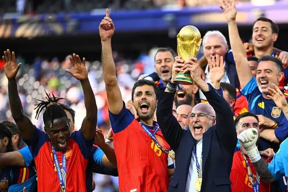 Team celebrating victory with FIFA World Cup trophy