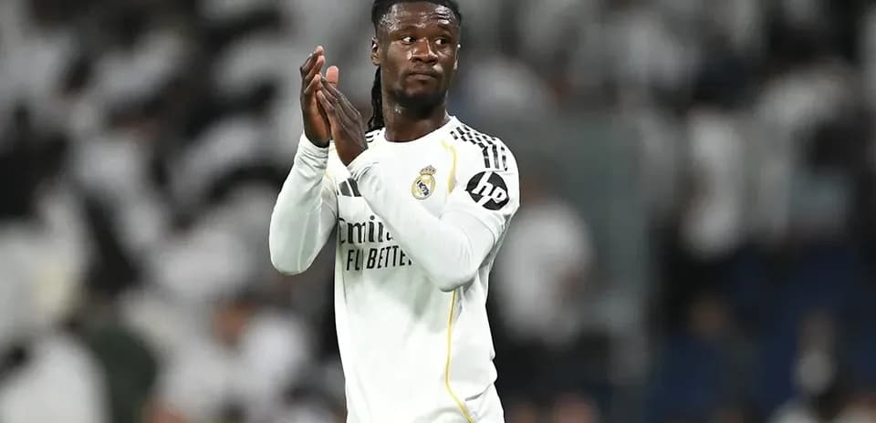 Player applauding fans in Real Madrid jersey
