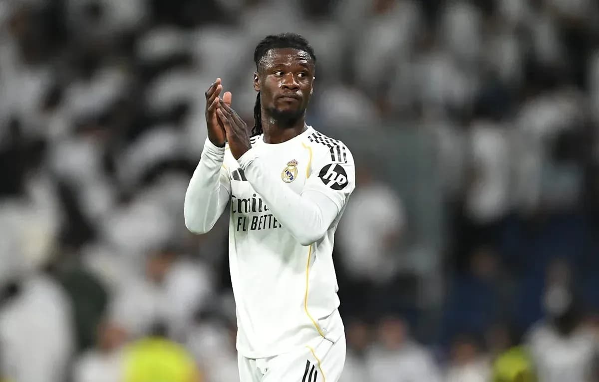 Player applauding fans in Real Madrid jersey