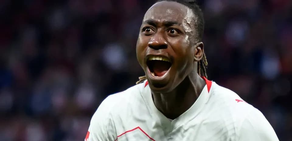 Player celebrating a goal with excitement on field