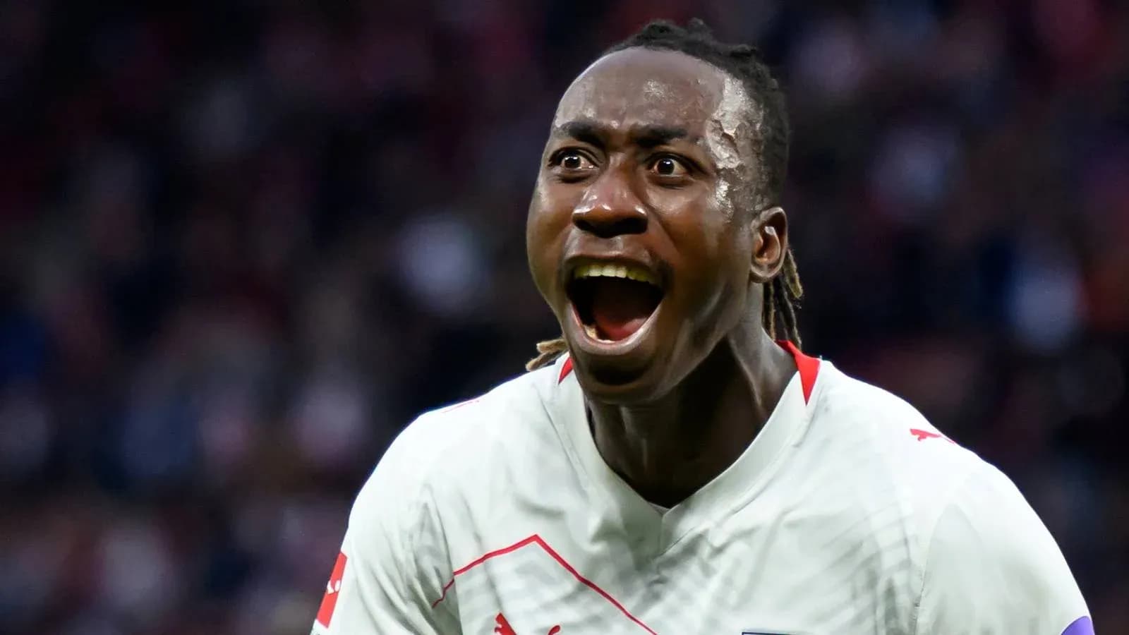 Player celebrating a goal with excitement on field
