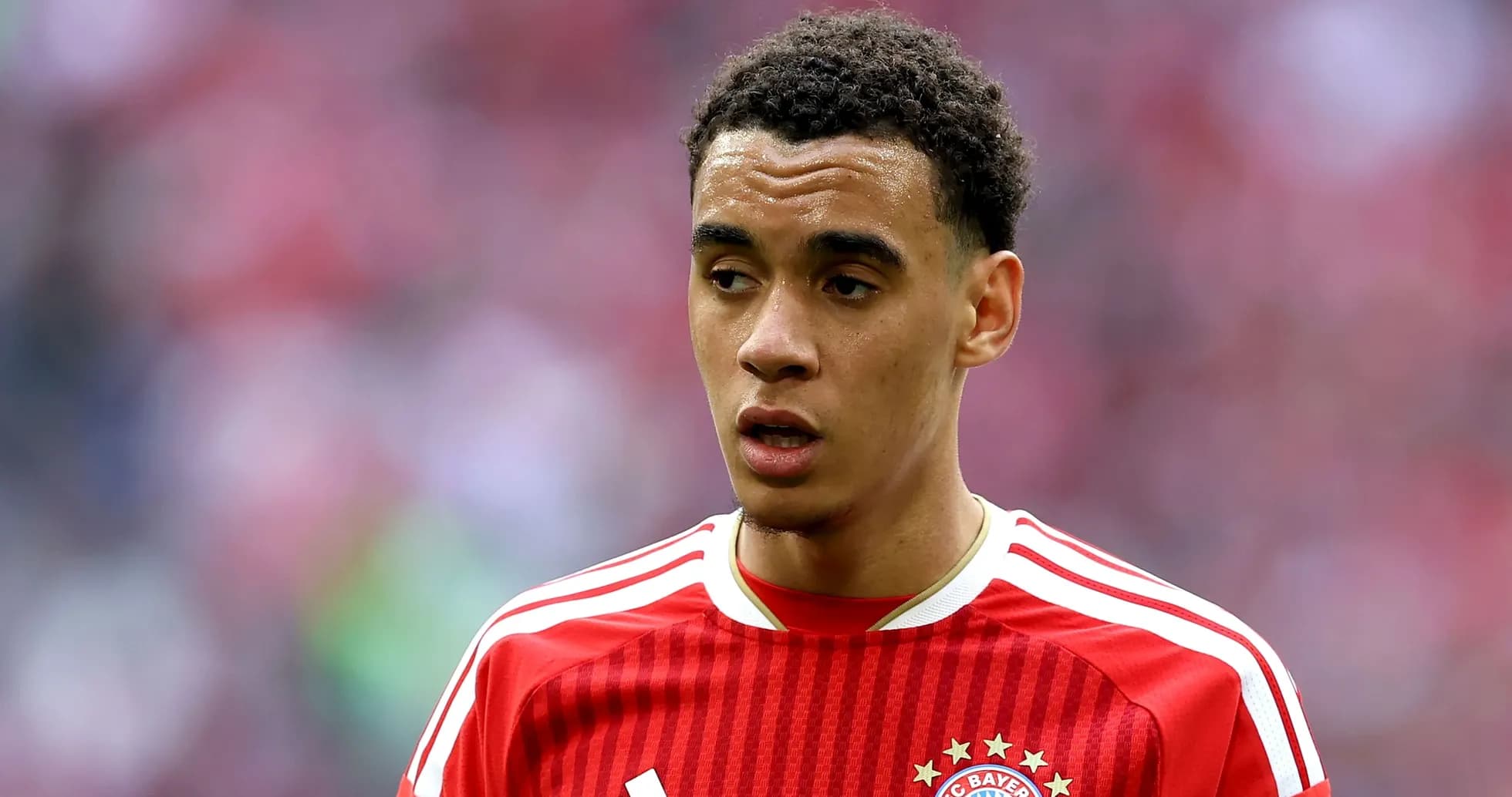 Player in red FC Bayern jersey during match