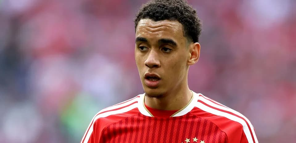 Player in red FC Bayern jersey during match