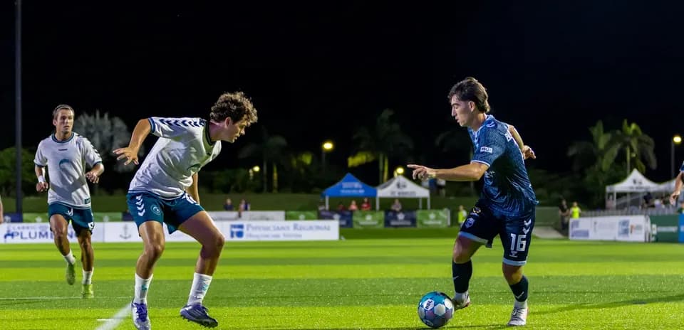Players competing for the ball during match