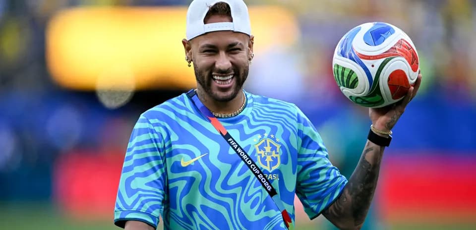 Player holding a soccer ball, wearing Brazil jersey