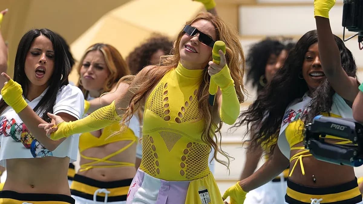 Performers dancing in bright outfits during a performance
