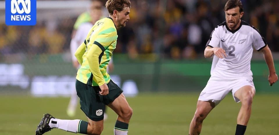 Player dribbling past opponent during football match