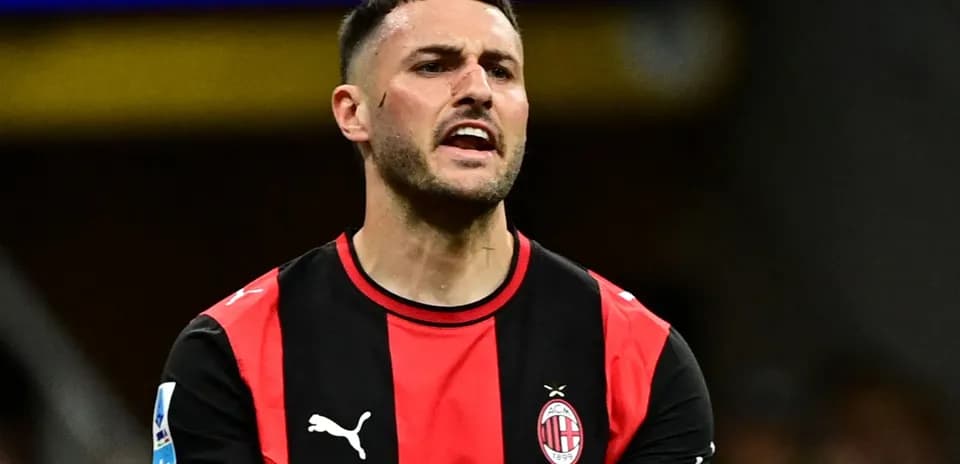 Player in AC Milan jersey reacting during match