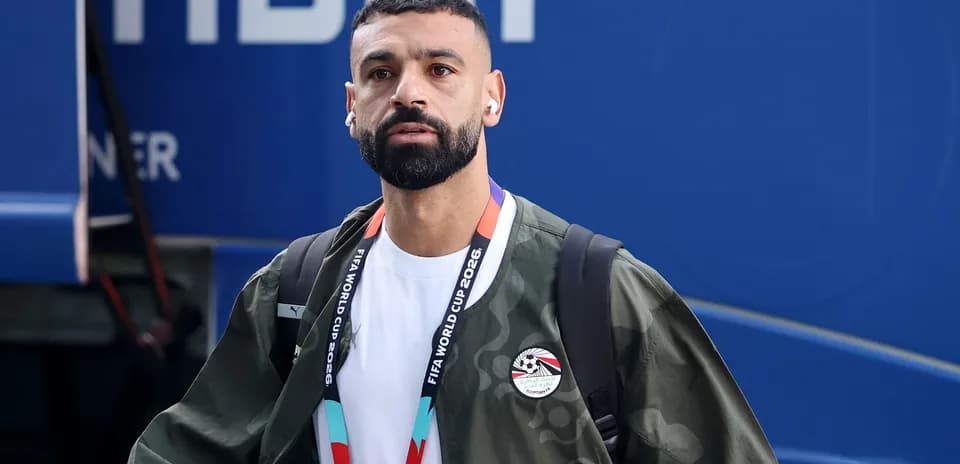 Player arriving at venue with headphones and bag