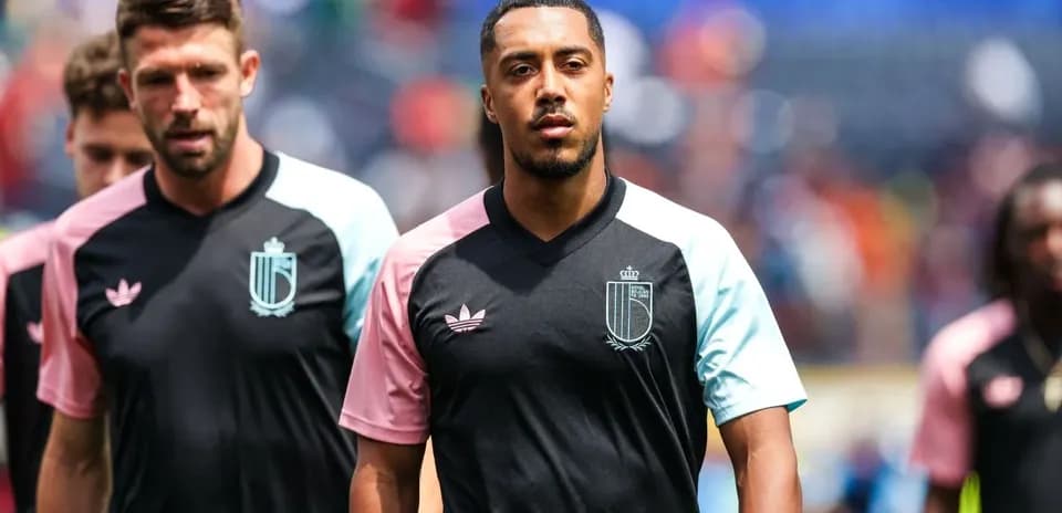 Players walking on the field in team jerseys