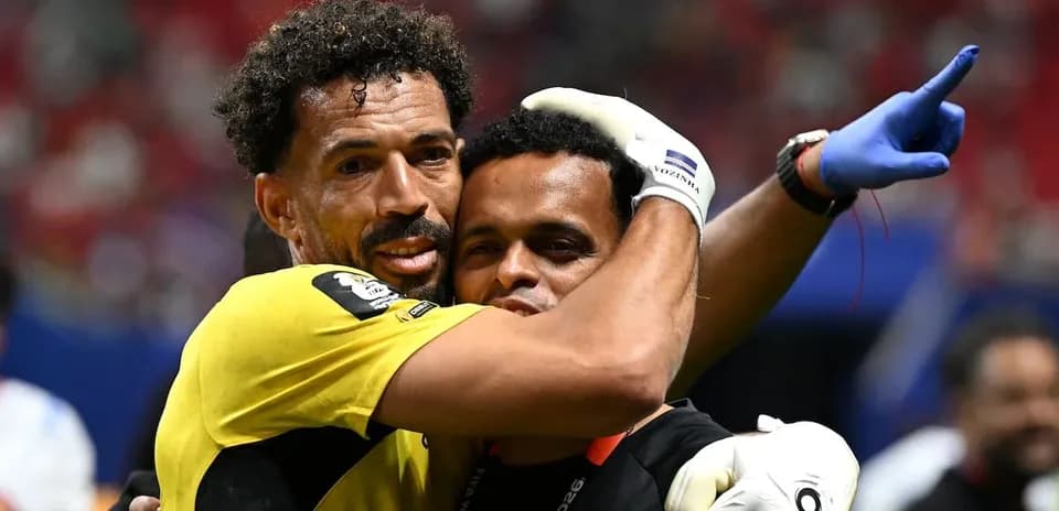Goalkeeper embracing a staff member after match