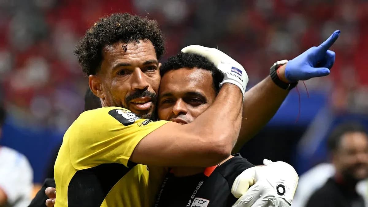 Goalkeeper embracing a staff member after match