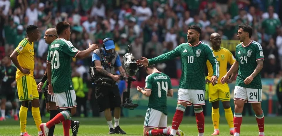 Mexico players celebrating during match against South Africa