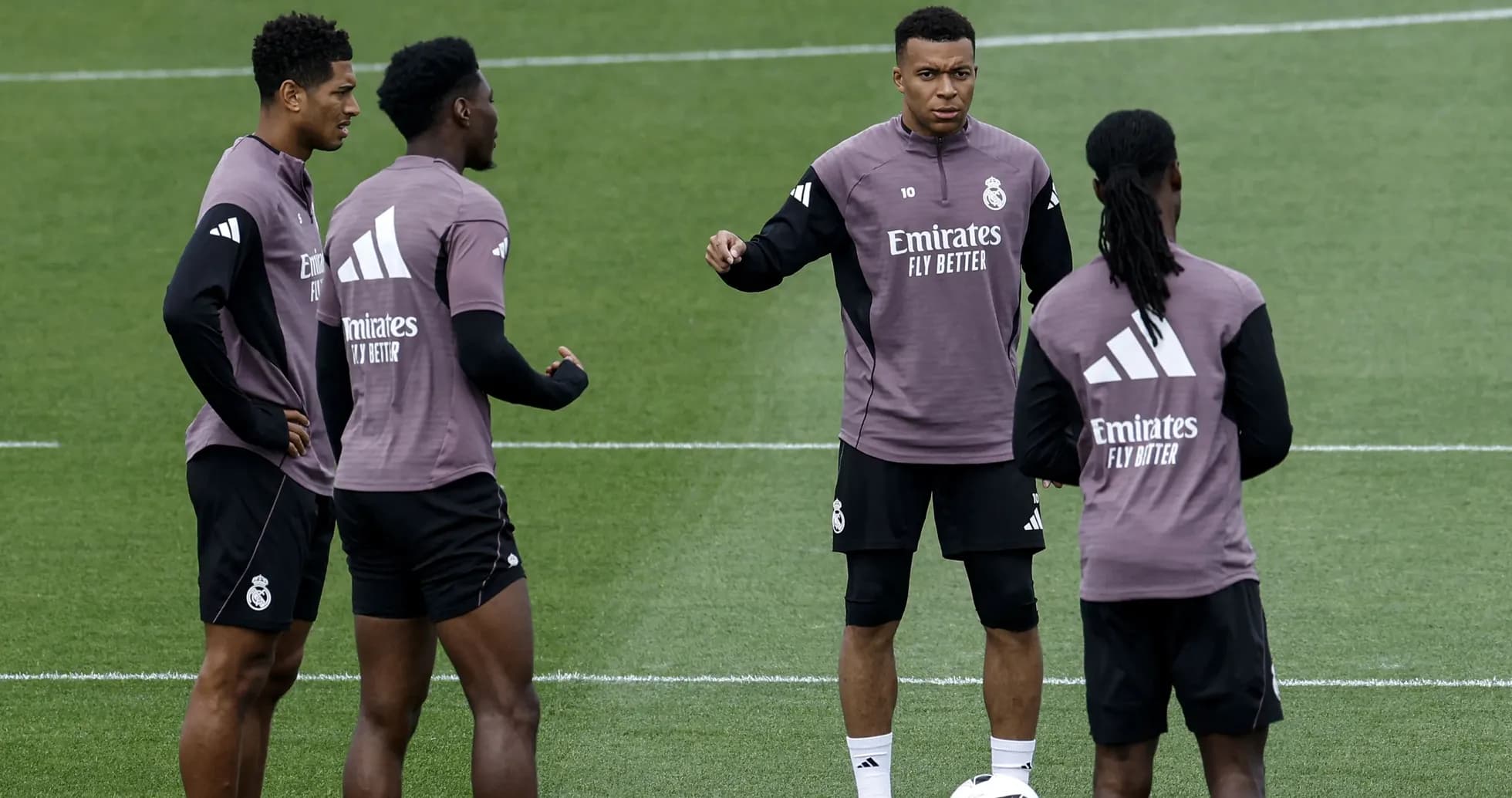 Players discussing during Real Madrid training session