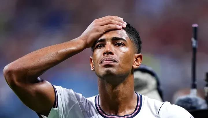 Player holding head in disappointment during match