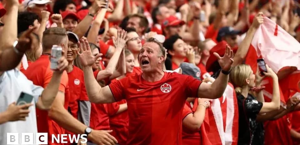 Fans celebrating in red during a sporting event