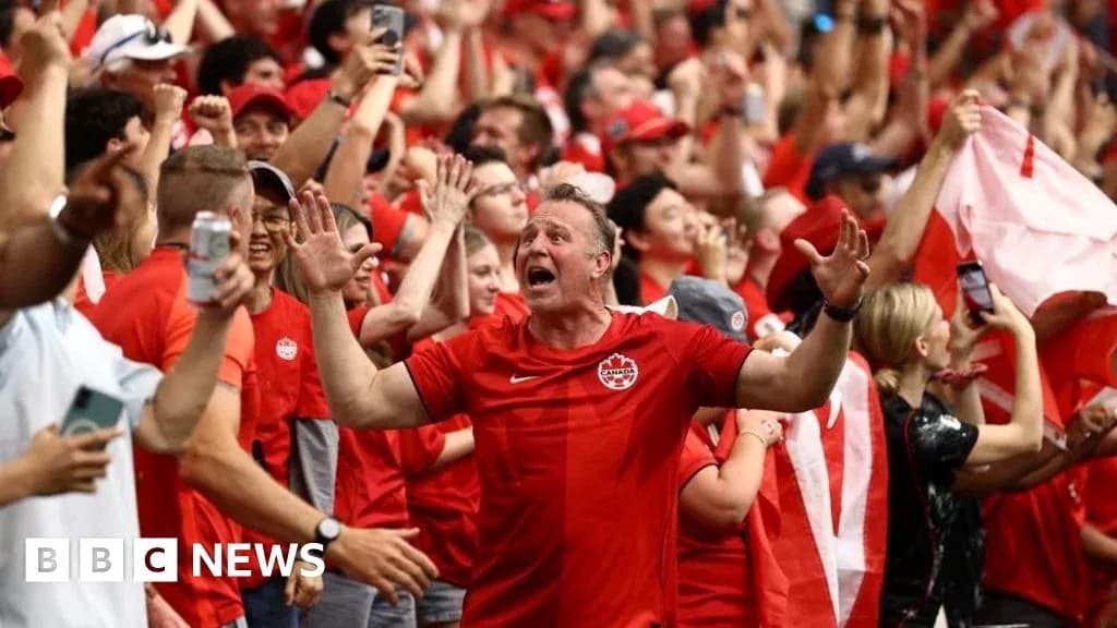Fans celebrating in red during a sporting event