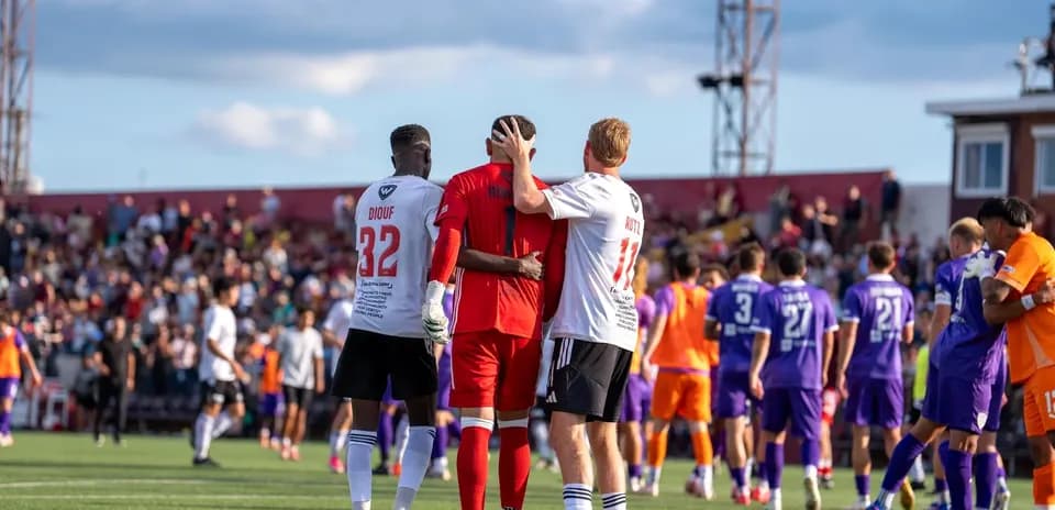 Players celebrating after the match conclusion