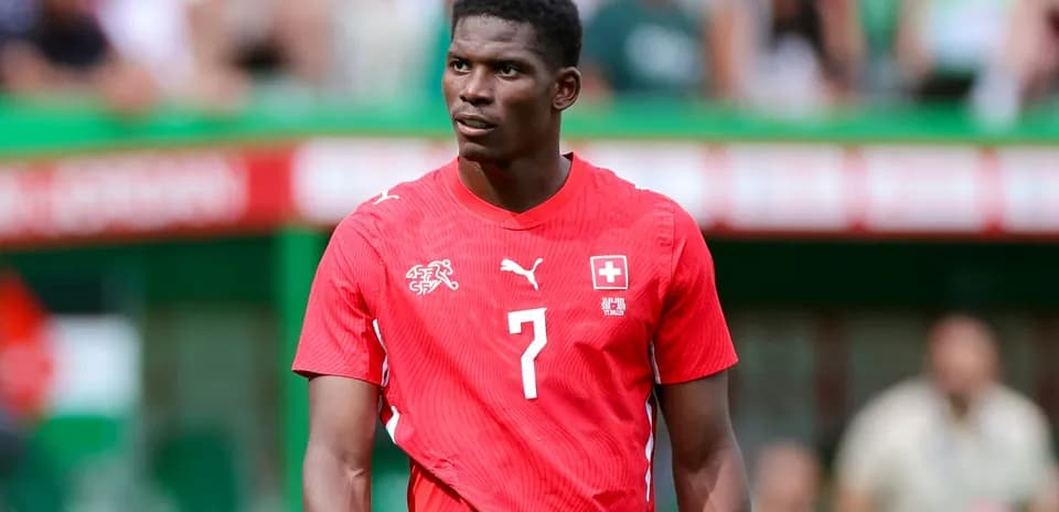 Player wearing red Switzerland jersey during match