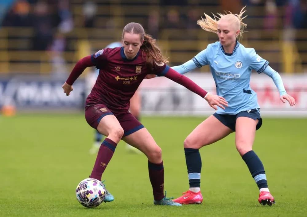 Two players contesting for the ball during match