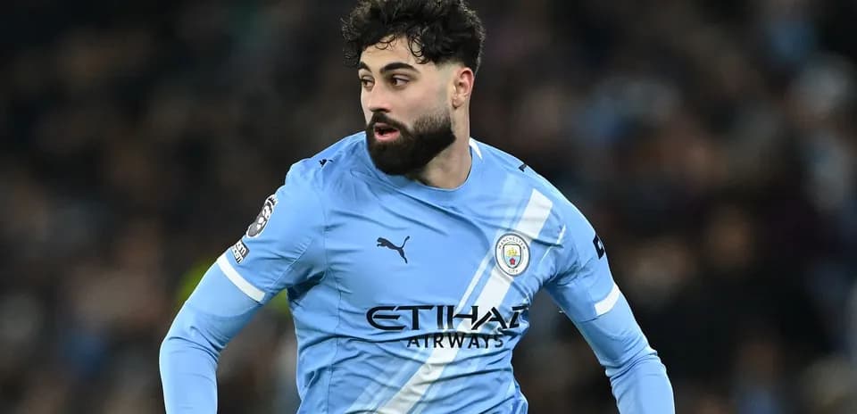 Player in Manchester City kit during match action