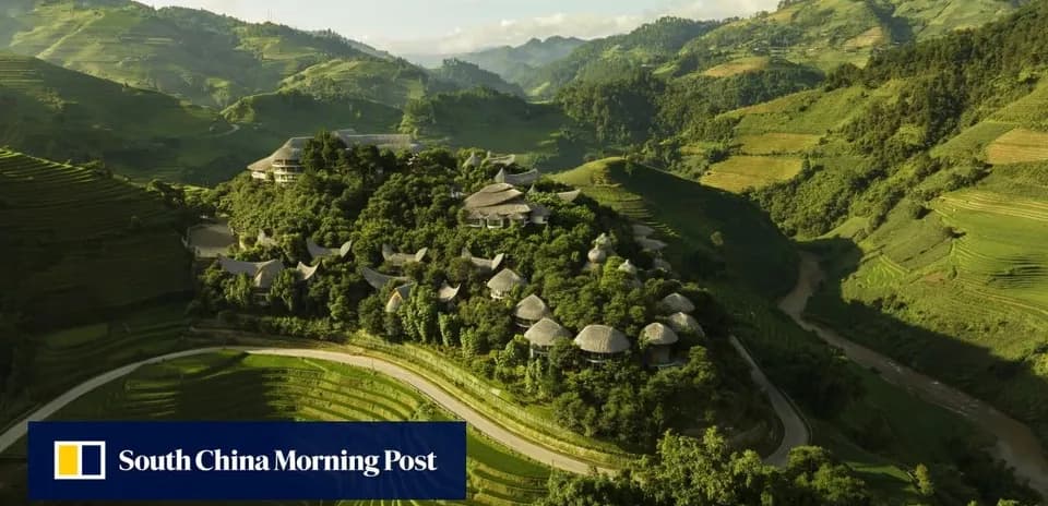 Aerial view of lush green terraced hills and buildings