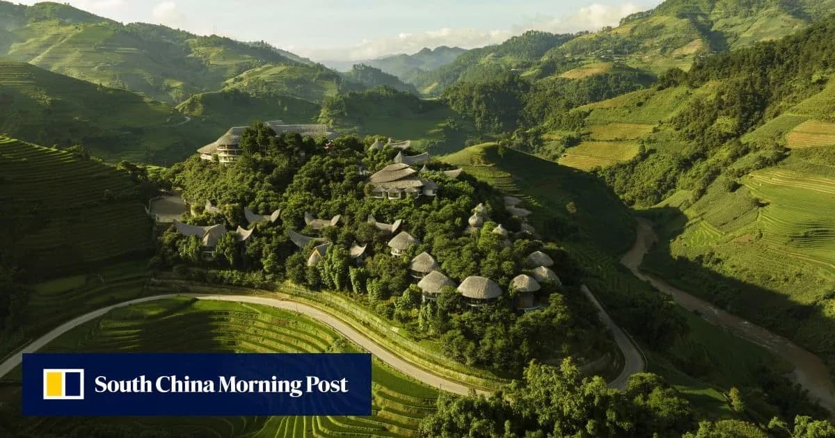 Aerial view of lush green terraced hills and buildings
