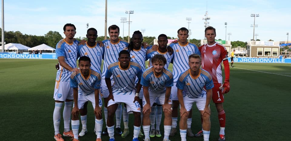 Sporting JAX team posing for photo before match