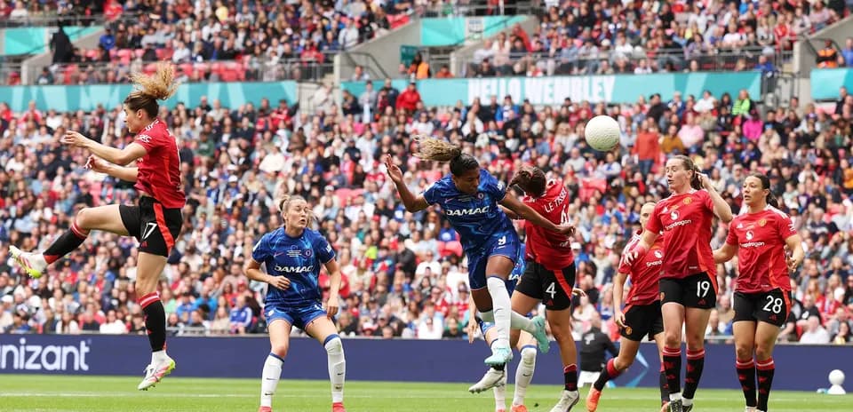 Chelsea and Manchester United players contesting the ball