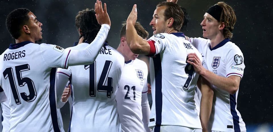 England players celebrating a goal together