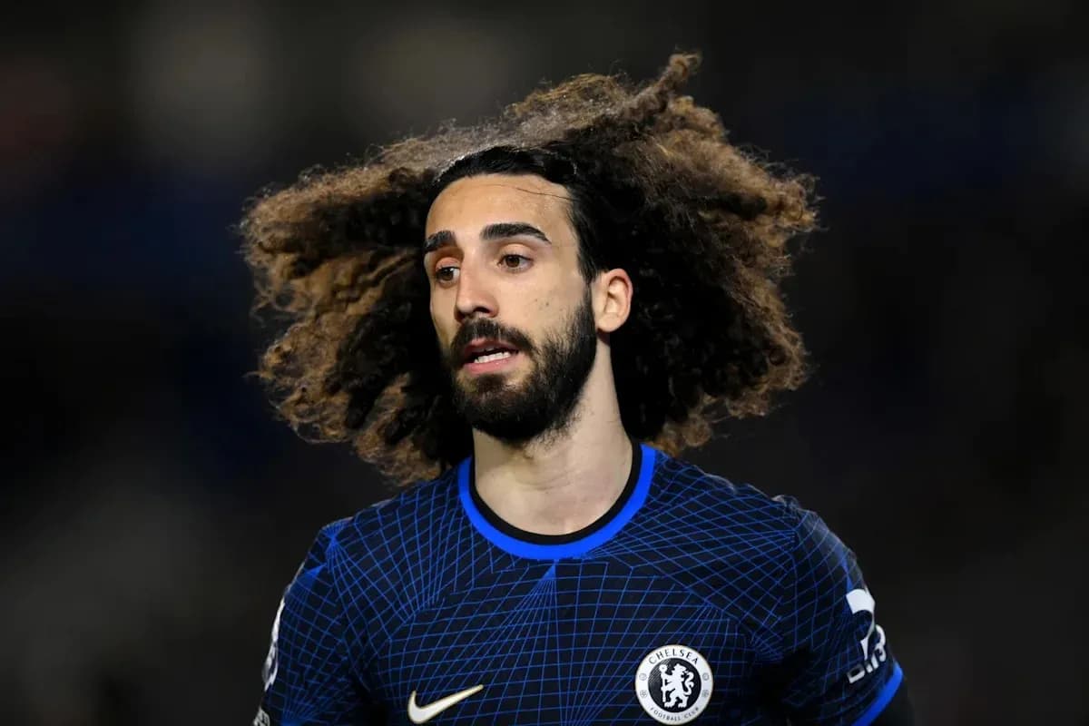 Player with curly hair in Chelsea jersey