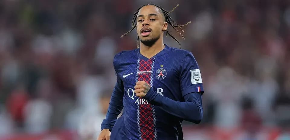 Player running in Paris Saint-Germain jersey on field